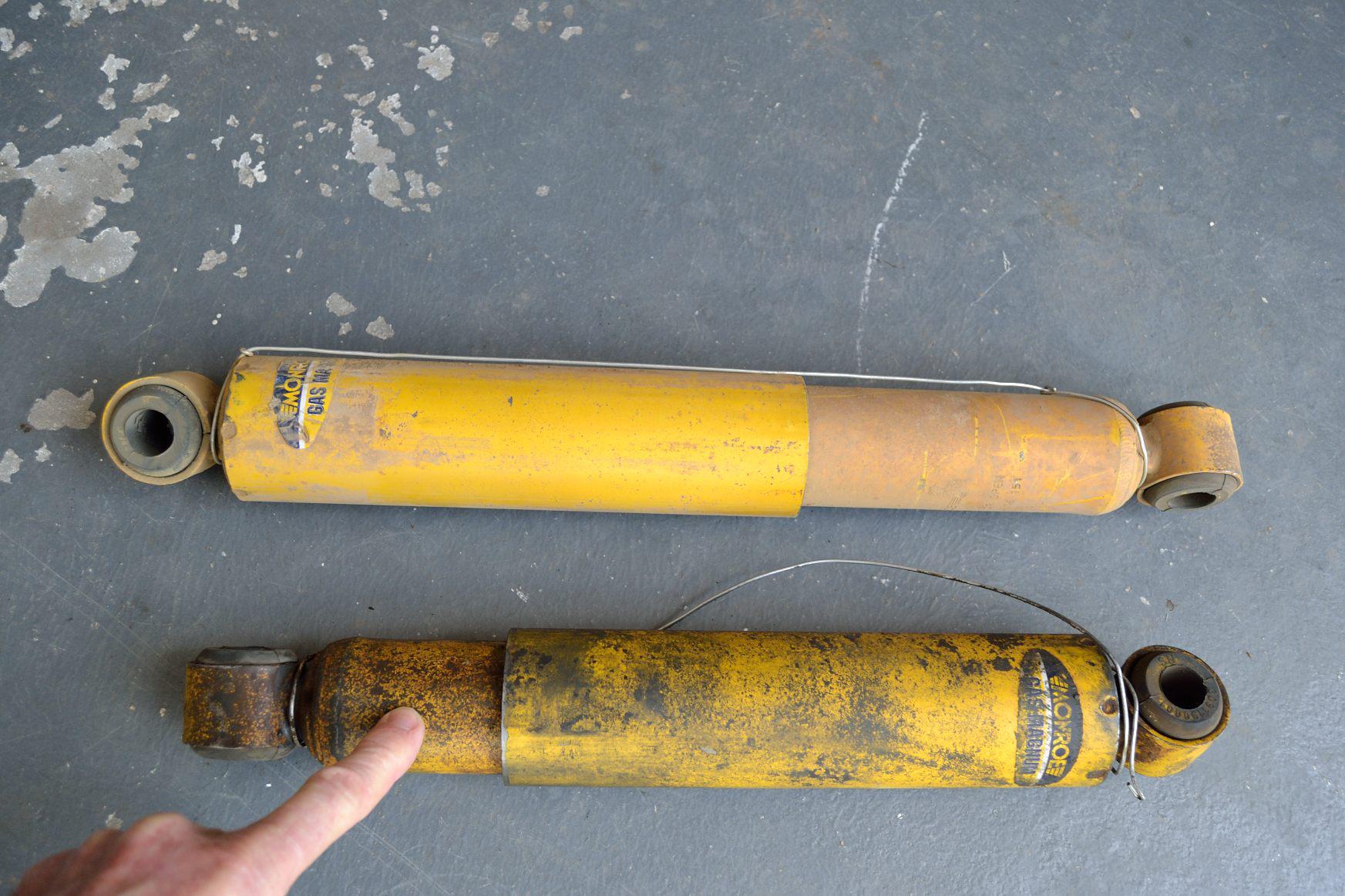 Normal dirt and problematic dirt (fingered) on a shock absorber.